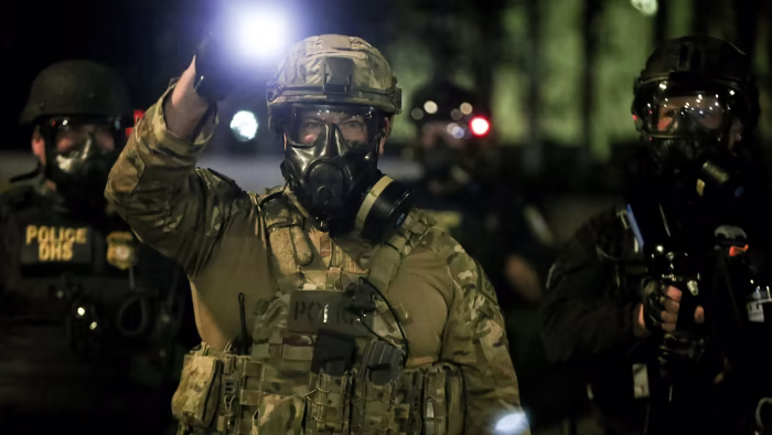 Militarized police officers in tactical gear